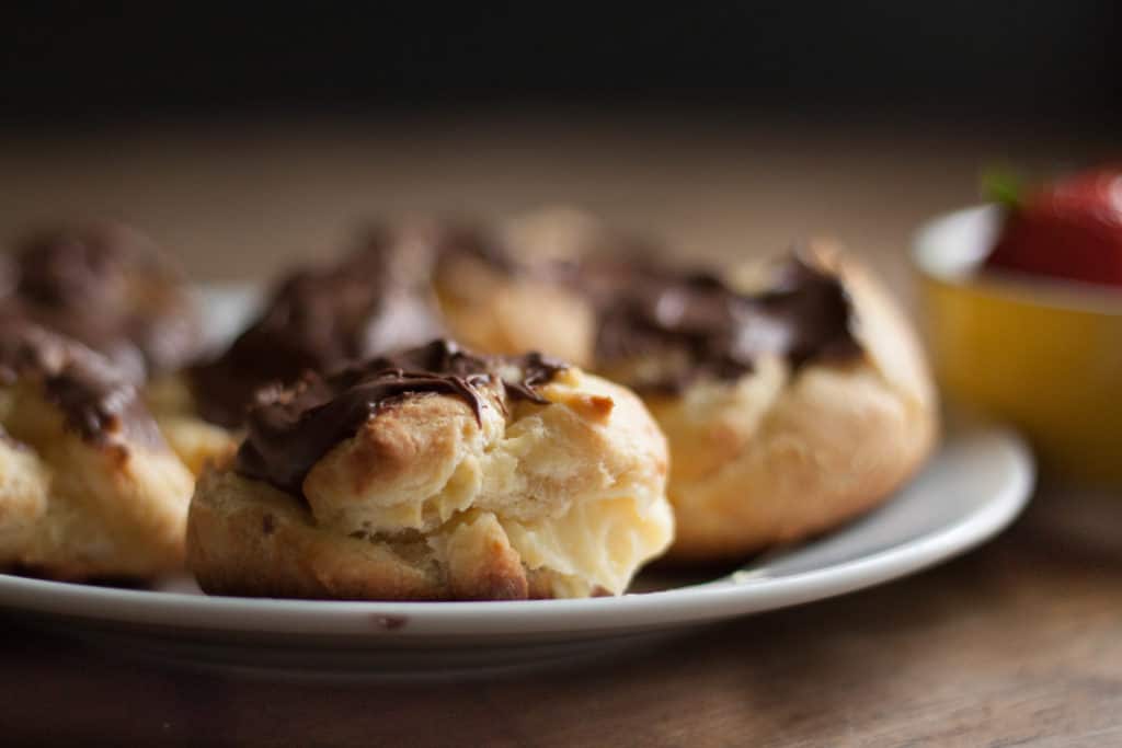 Rich Chocolate Eclairs - Chocolate eclairs with a creamy custard filling. What's not to like?! | wanderzestblog.com