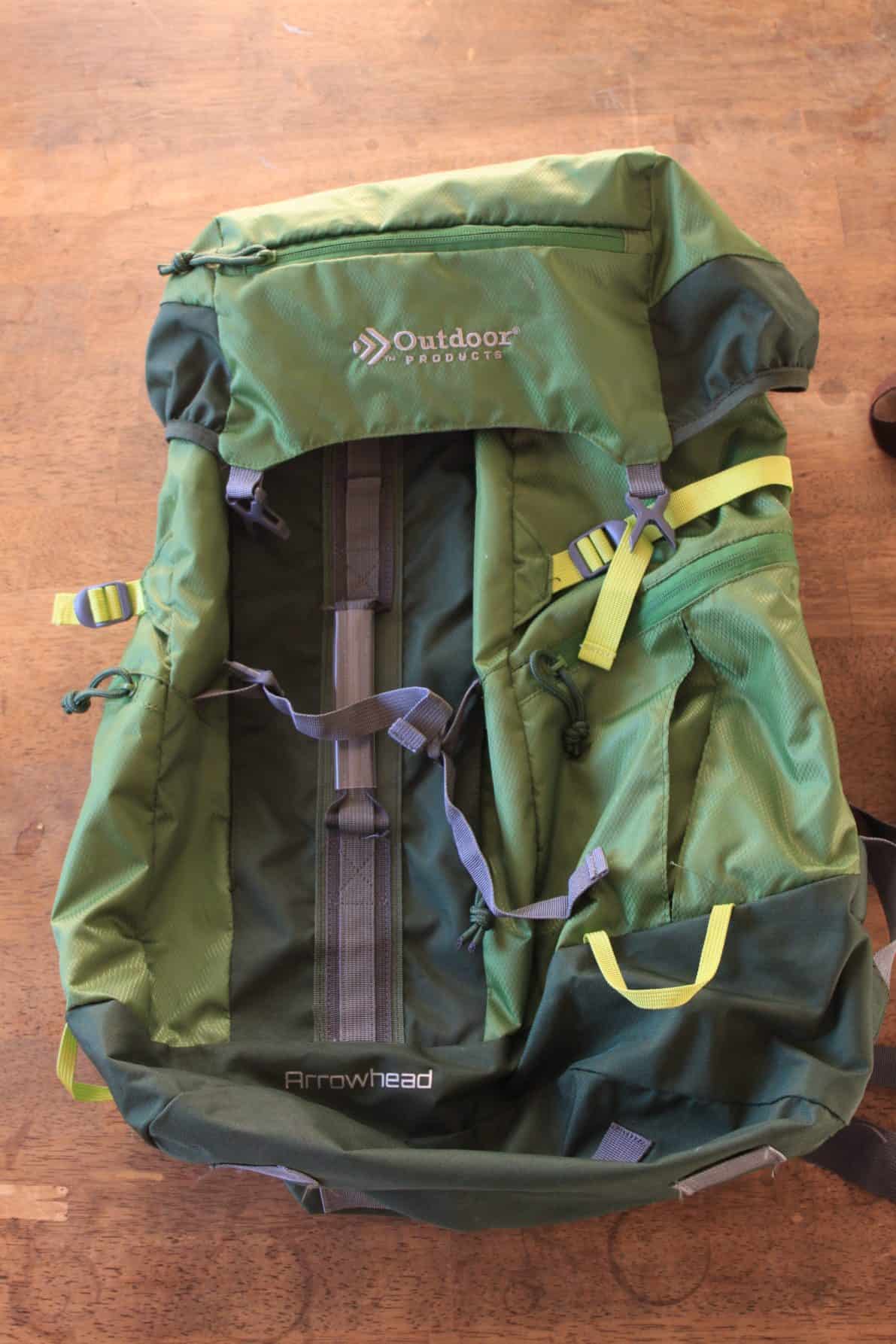 Green backpacking bag to travel the world with a backpack.