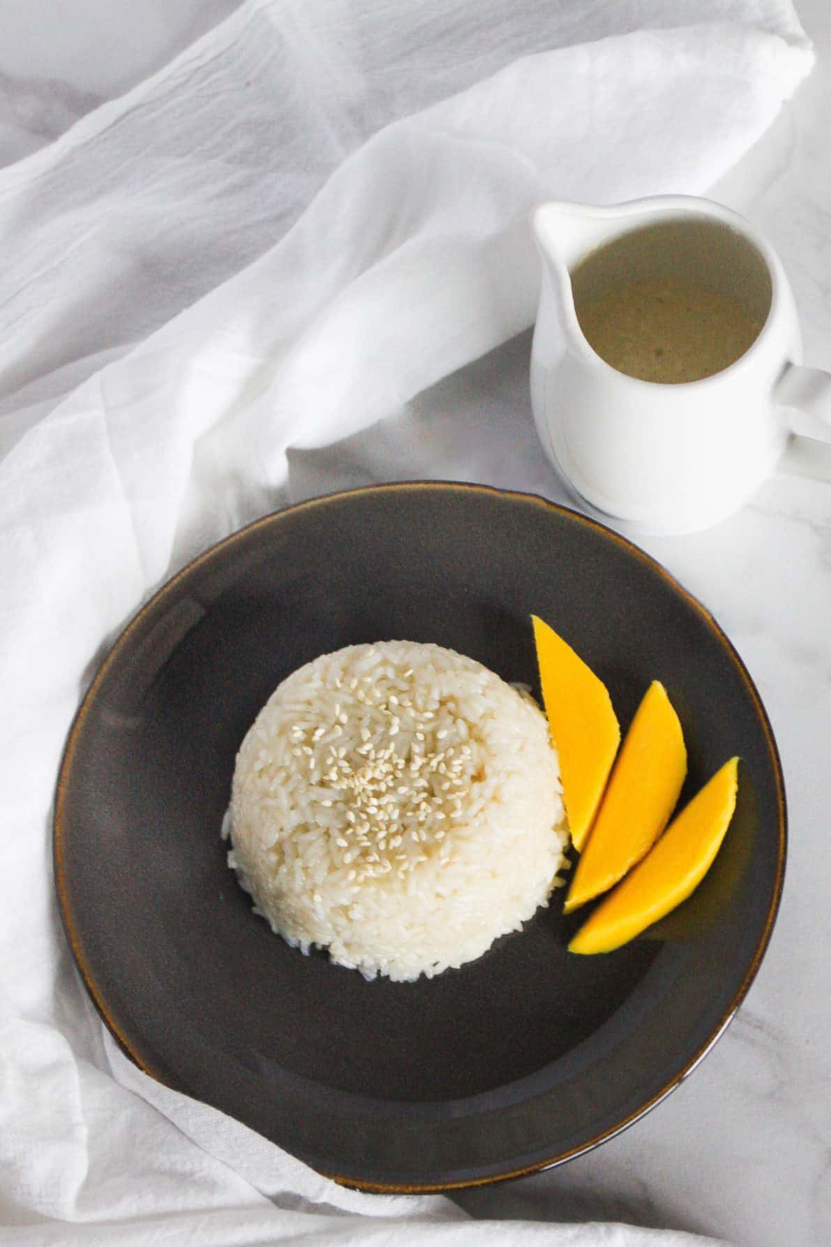 Thai Mango Sticky Rice only uses four ingredients and it's so easy to make! A simple, yet satisfying treat to whip up whenever you are feeling in the mood for something sweet and delectable.