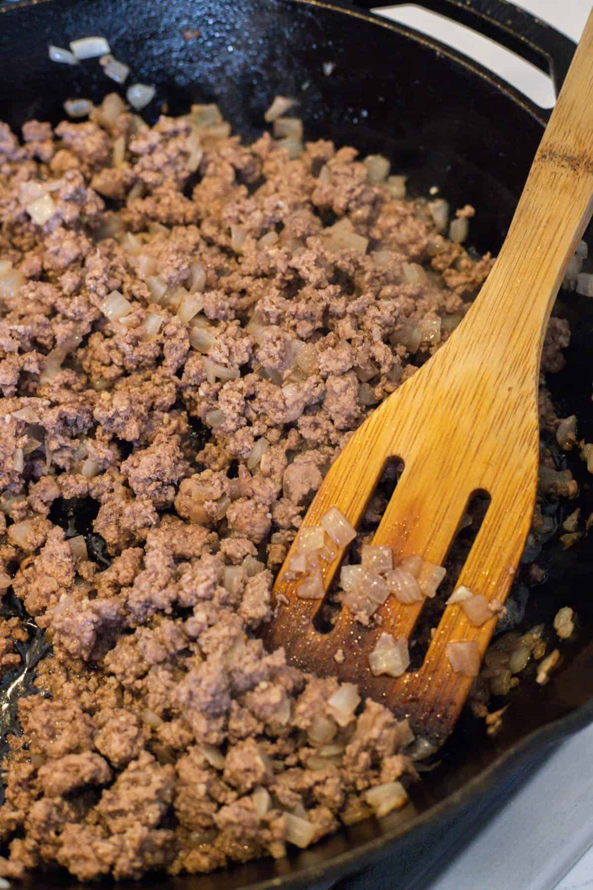 A pot of cooking ground beef.