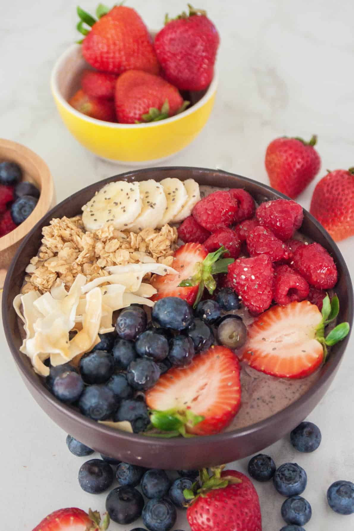 Homemade Hawaiian Acai Bowl topped with fresh berries and other tasty toppings.