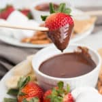 Chocolate Fondue is a fun and easy dessert experience! This no-fuss recipe is silky smooth and decadent, perfect for a variety of dipping options.This dessert is sure to be at hit at an party. | wanderzestblog.com #fondue #chocolate #party #dessert #holiday