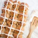 Hot Cross Buns in a glass pan.