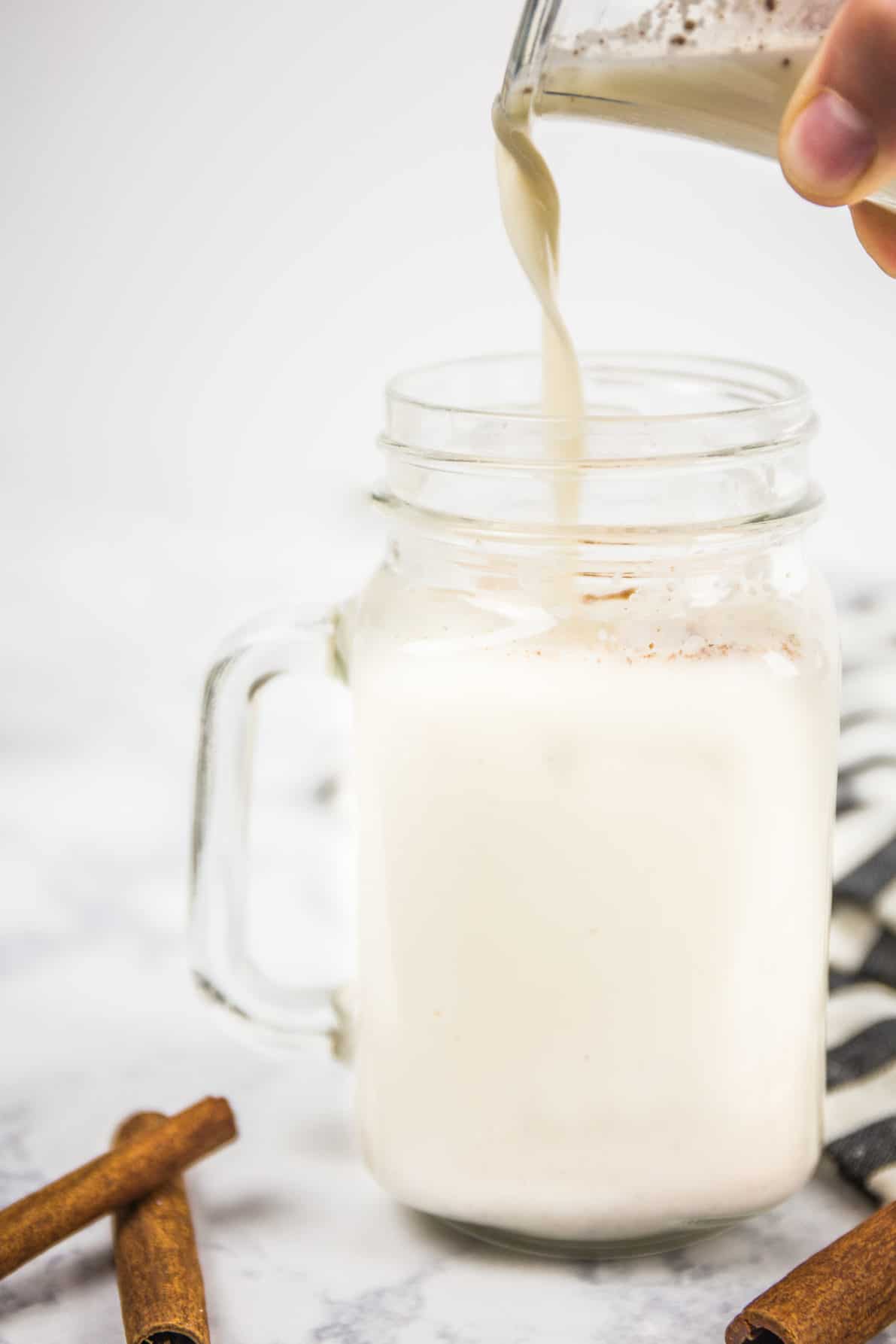 Pouring Mexican Horchata into a glass.