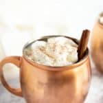 A copper mug filled with Mexican hot chocolate.