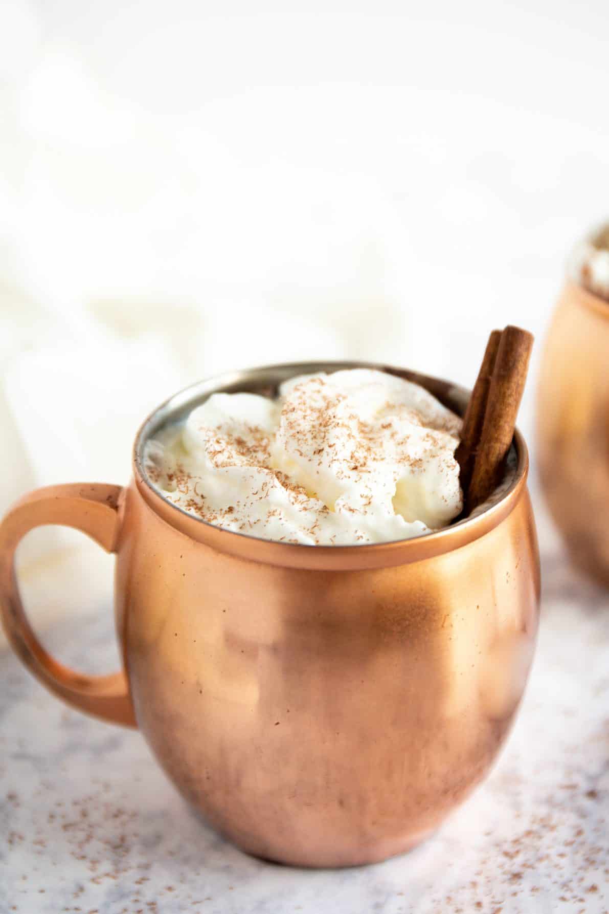 A copper mug filled with Mexican hot chocolate.