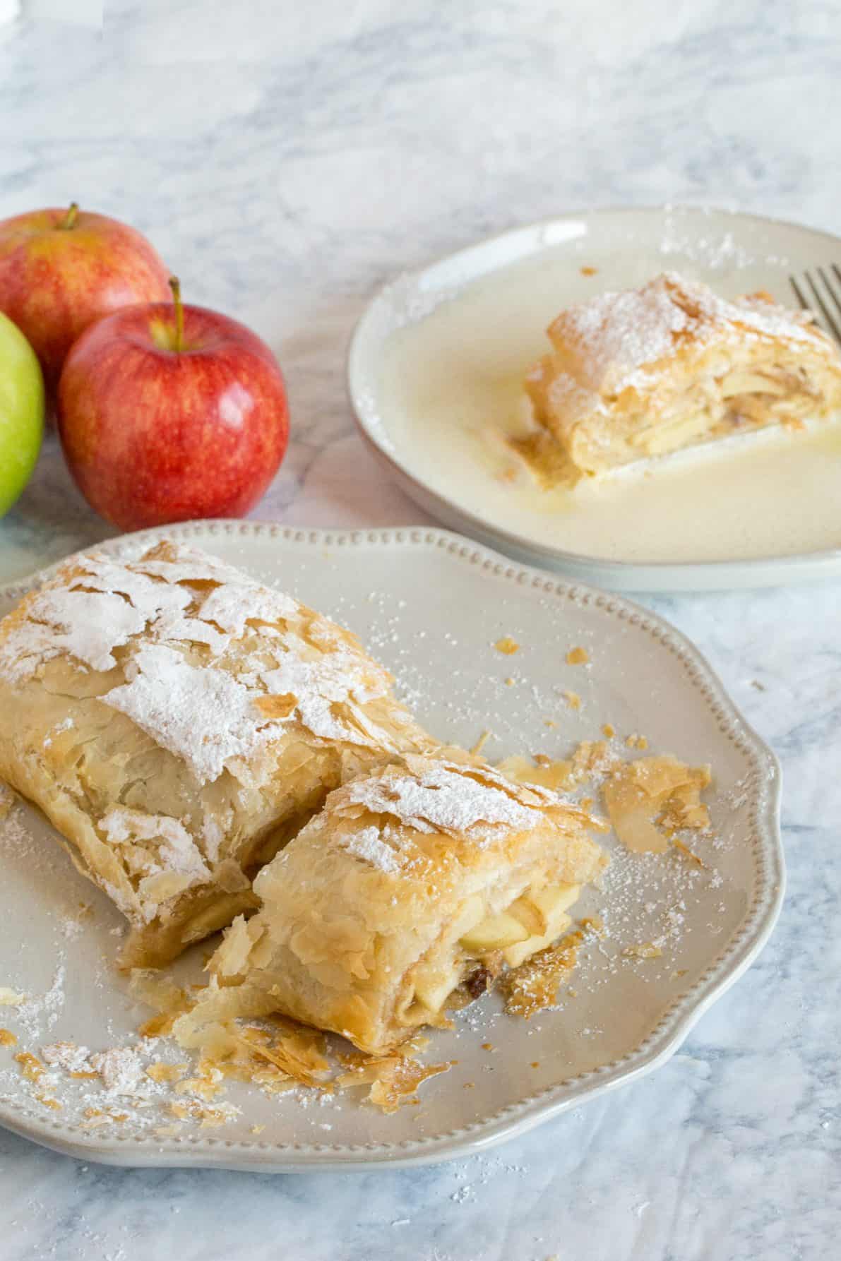 Apple strudel on a white plate.