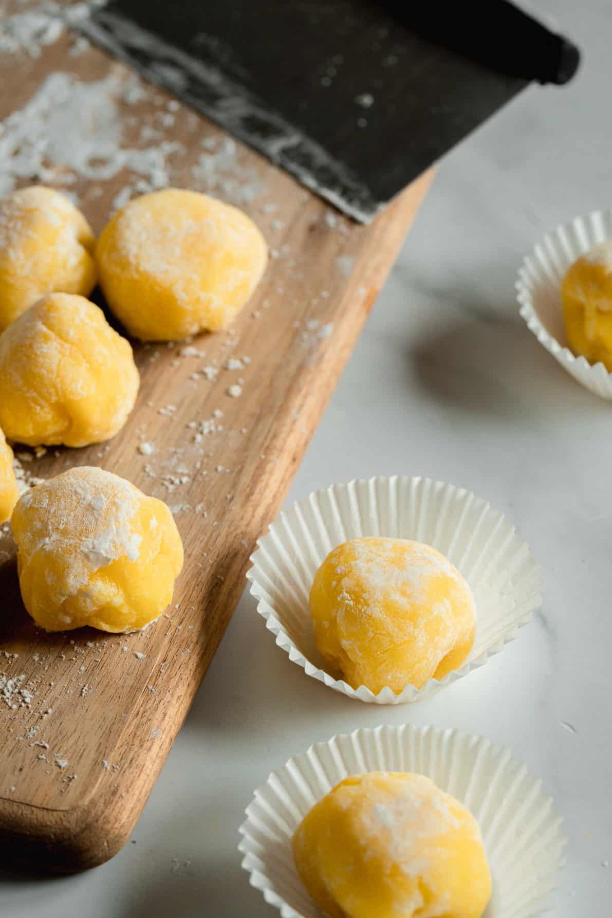 Custard Mochi on a marble surface.