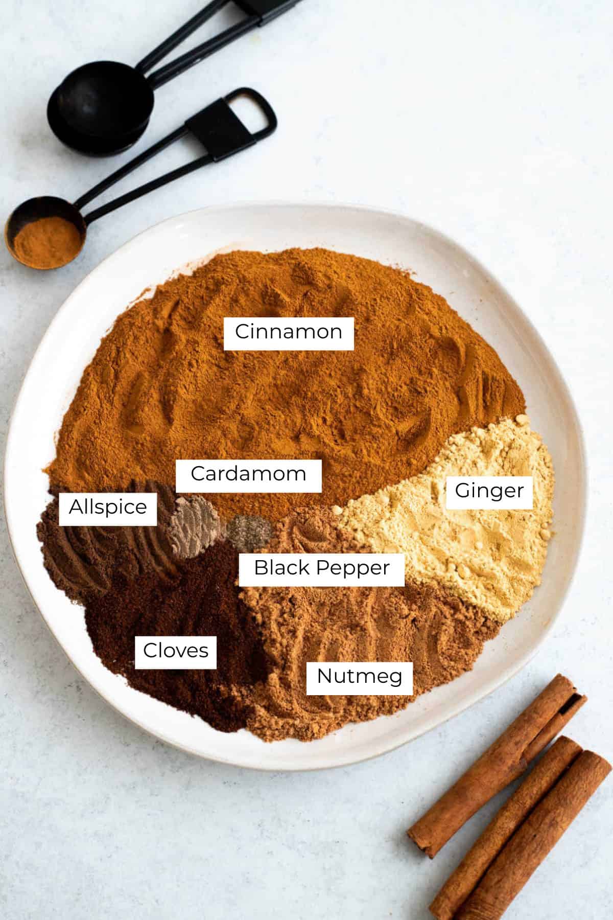 Ingredients labeled and laid out for pumpkin pie spice.