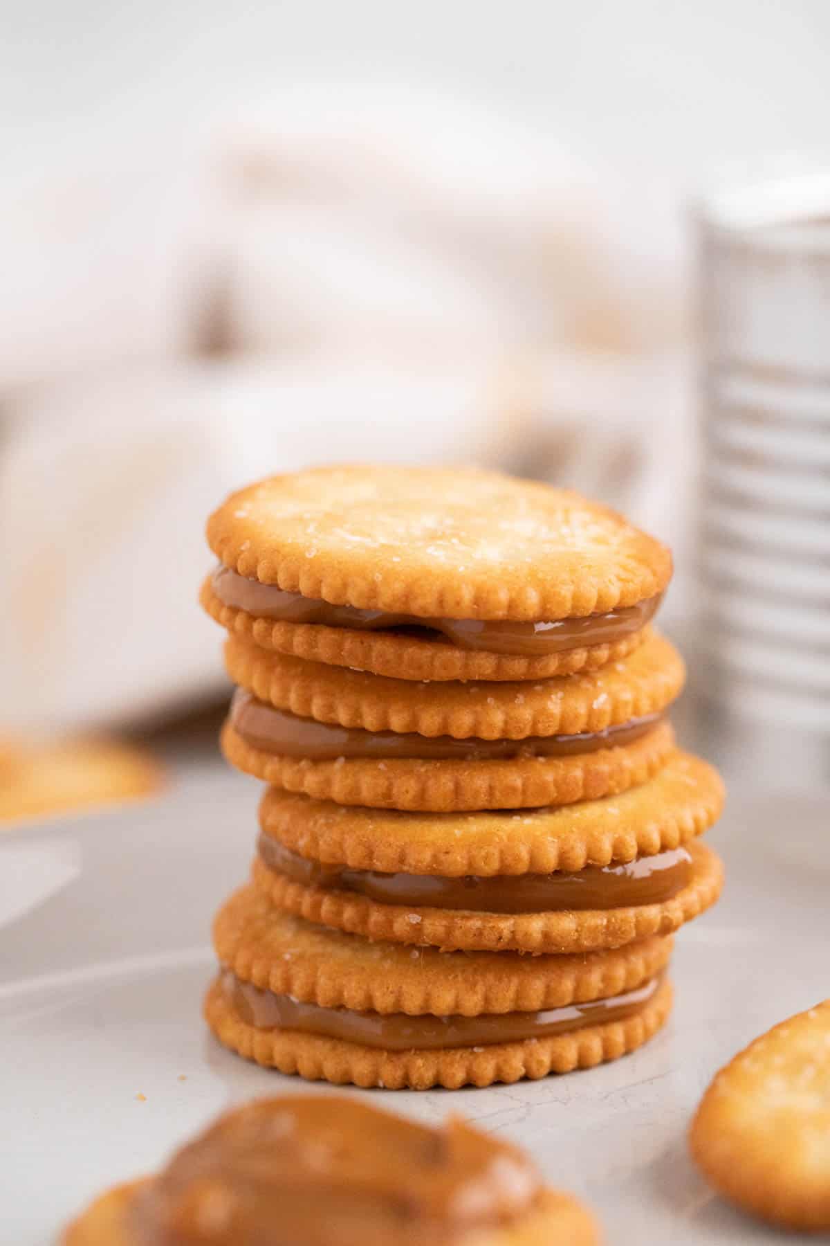 A stack of crackers sandwiched with dulce de leche.
