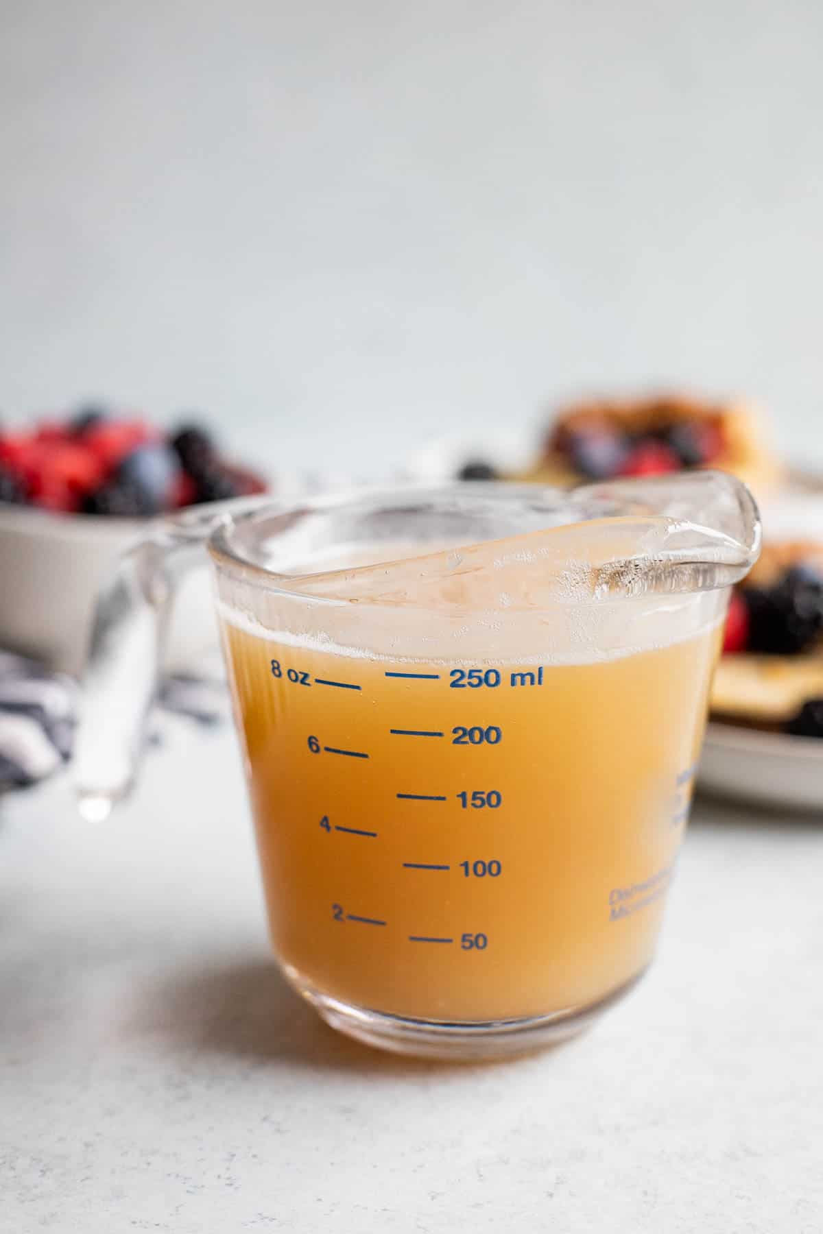 Buttermilk syrup in a glass measuring cup.