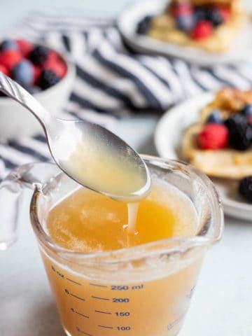 Buttermilk Syrup in a glass measuring cup.