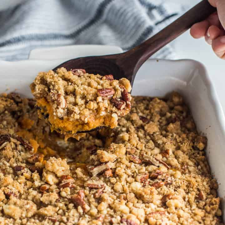 A white pan filled with sweet potato souffle.