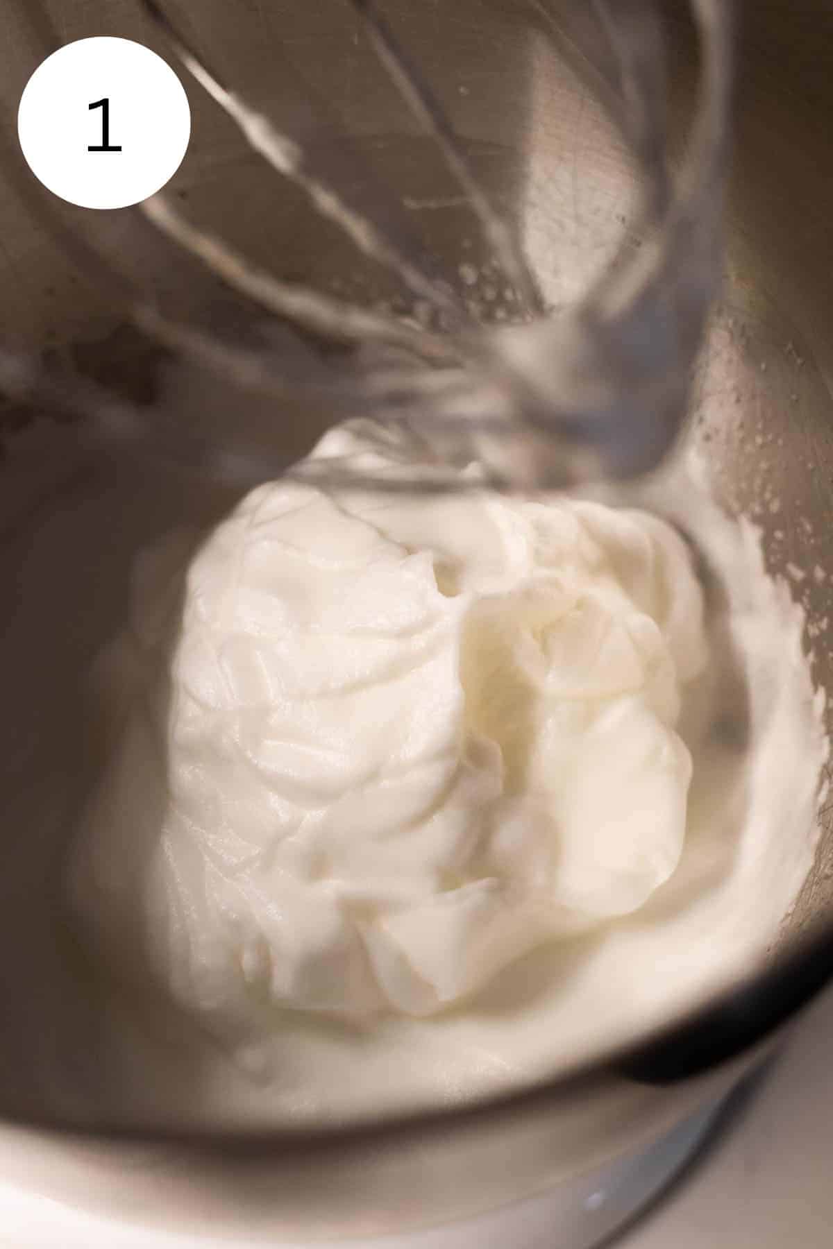 Whipped egg whites in a mixing bowl.