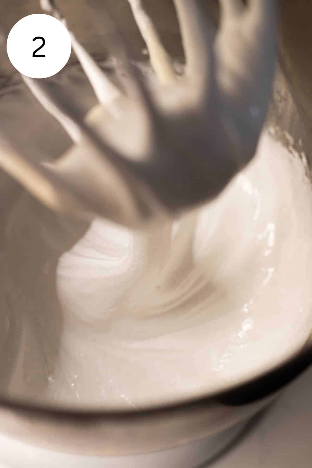 Beaten meringue in a mixing bowl.