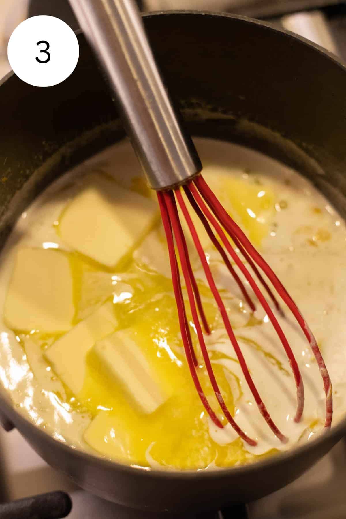 Whisking butter into lemon curd.