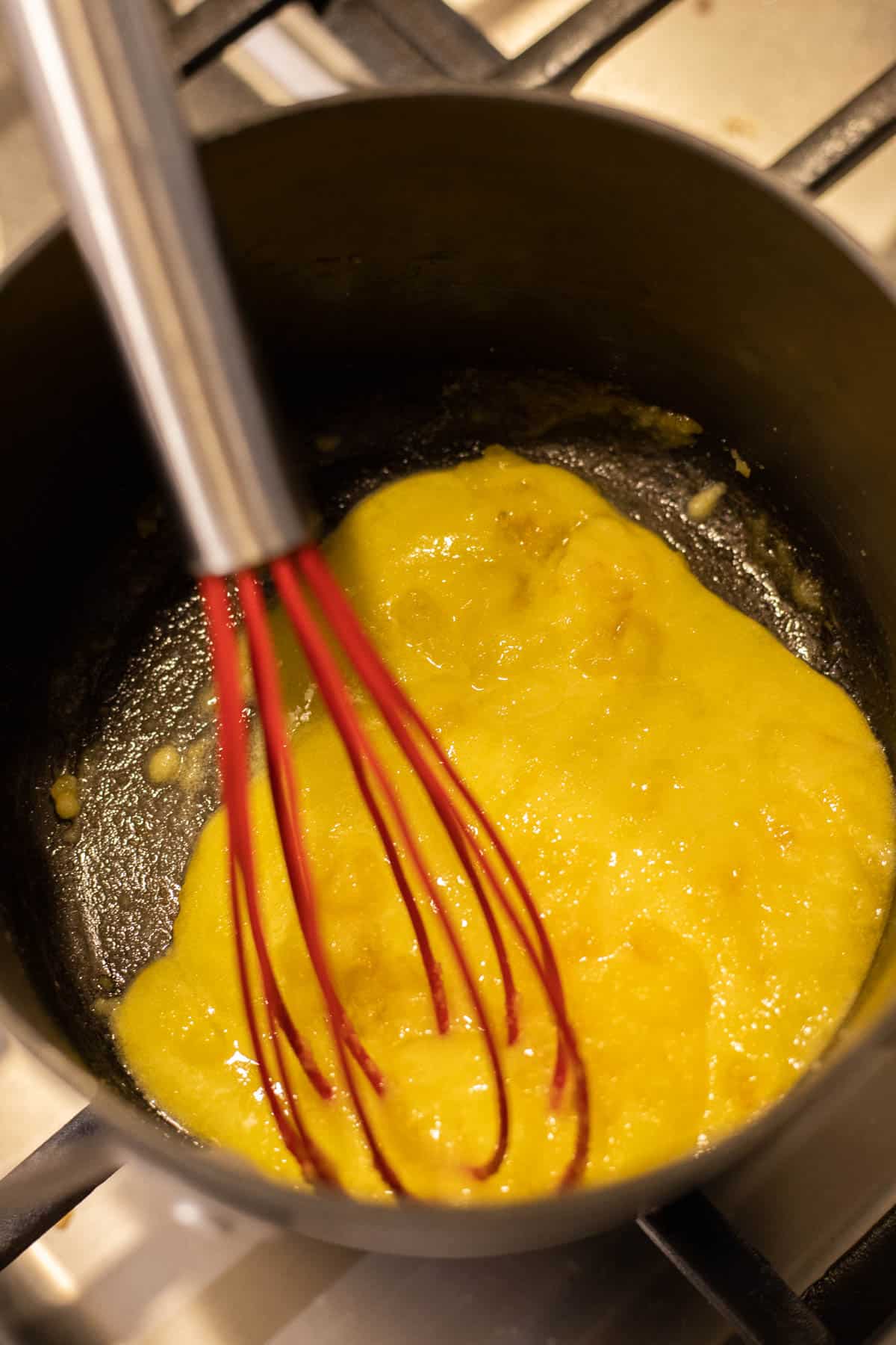Ingredients for lemon curd in a saucepan.