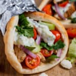 Chicken gyro on a wood surface.