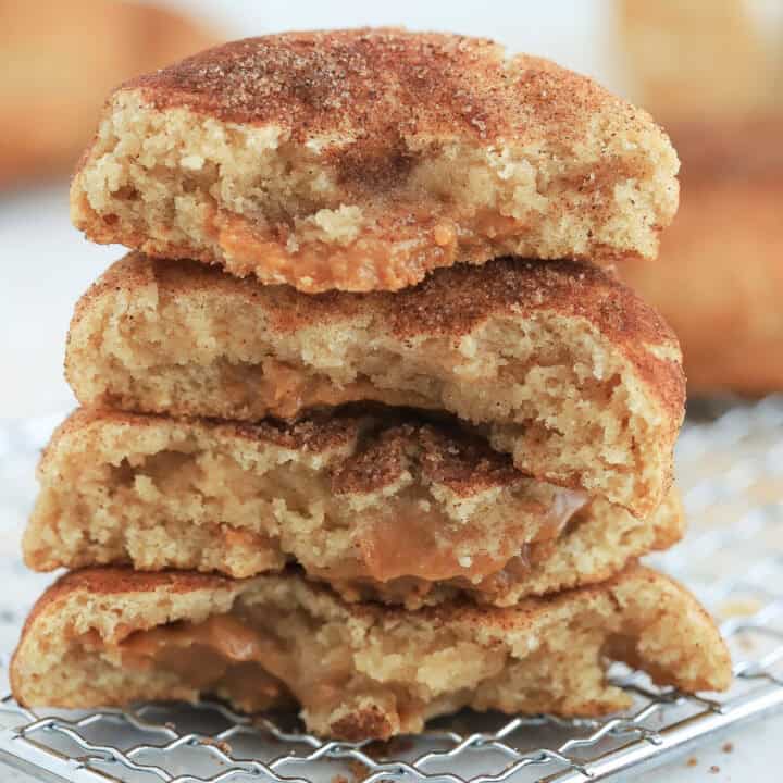 Dulce de leche snickerdoodles broken in half and placed in a stack.