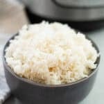 Gray bowl filled with rice next to an Instant Pot.