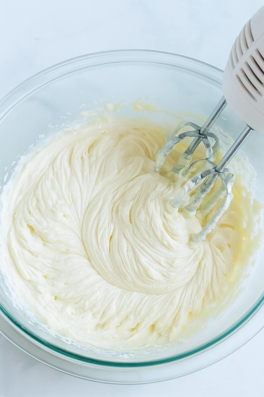 Mixer beating cream cheese mixture.