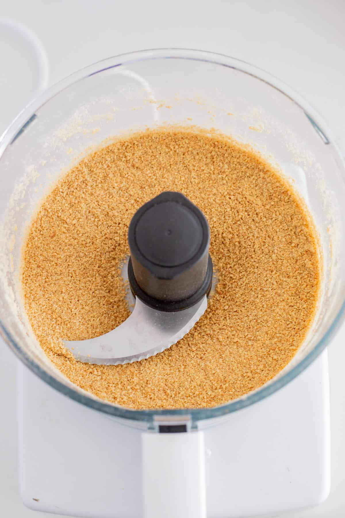 Graham cracker crumbs in food processor.