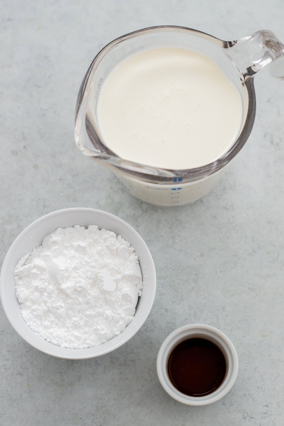 Ingredients laid out for whipped cream.