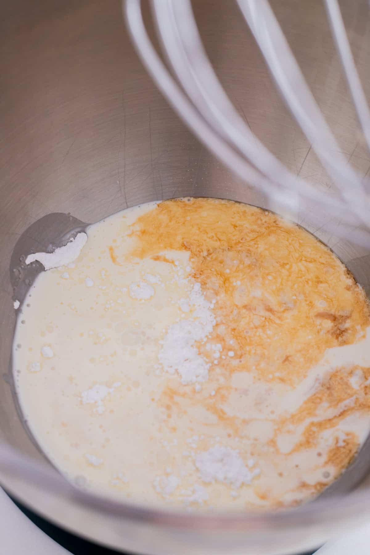 Whipped cream ingredients in mixing bowl.