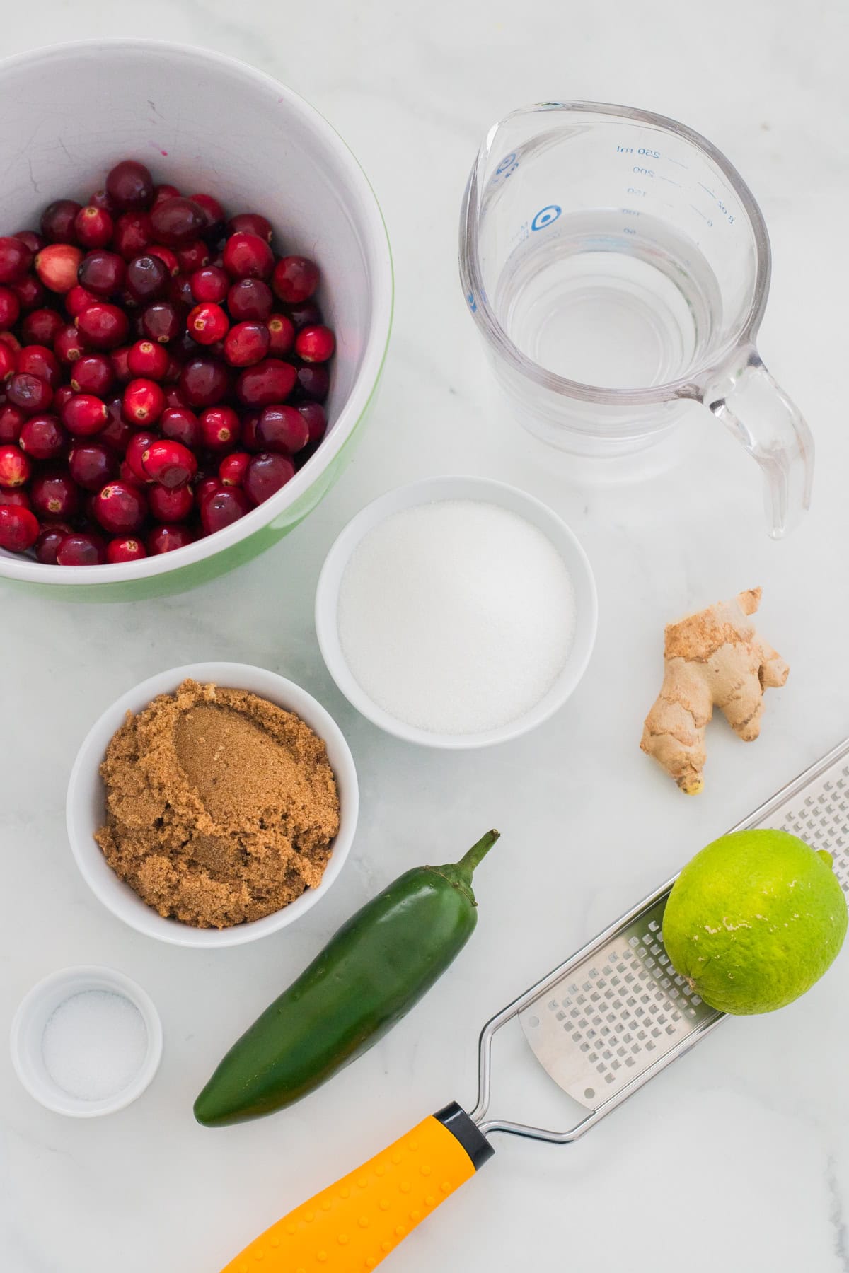 Ingredients laid out for jalapeno cranberry sauce.
