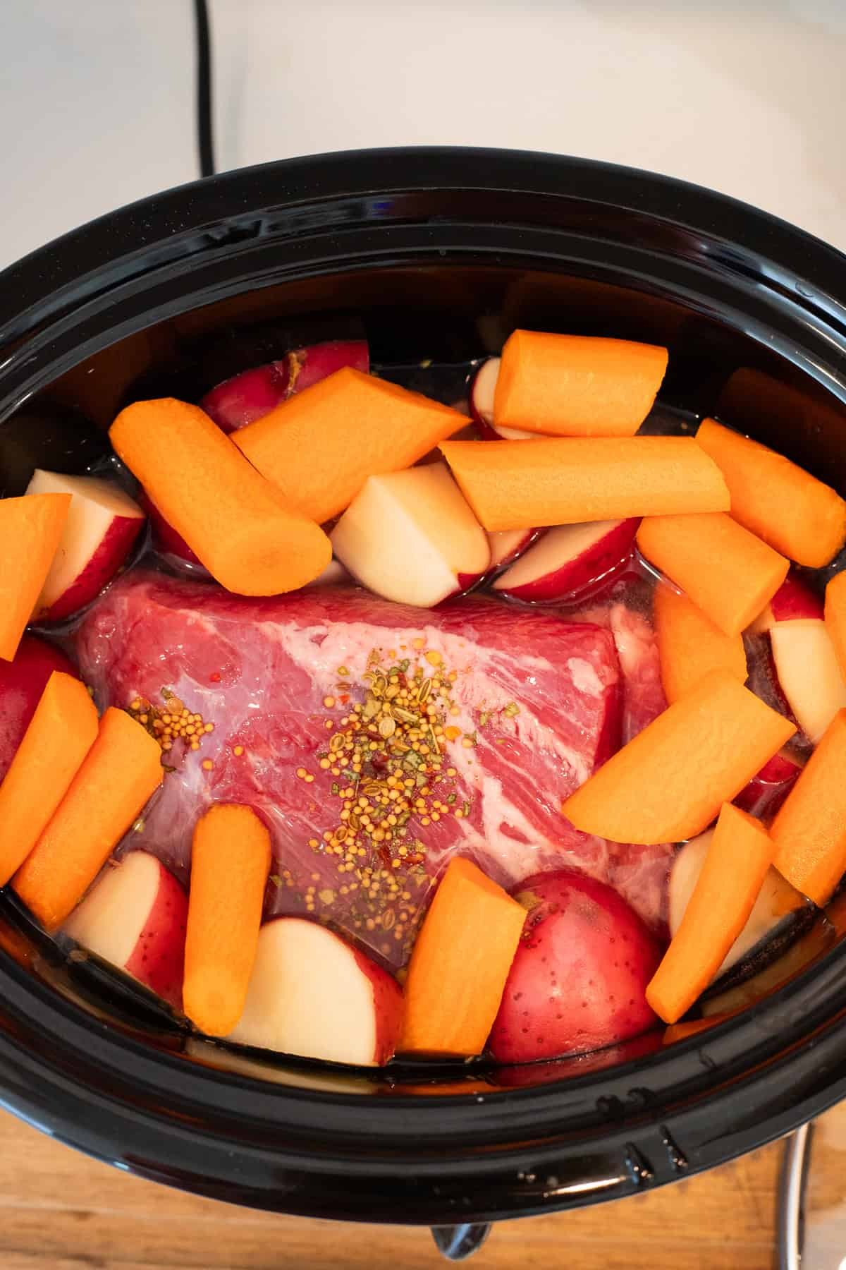 Corned beef and veggies in a crockpot.
