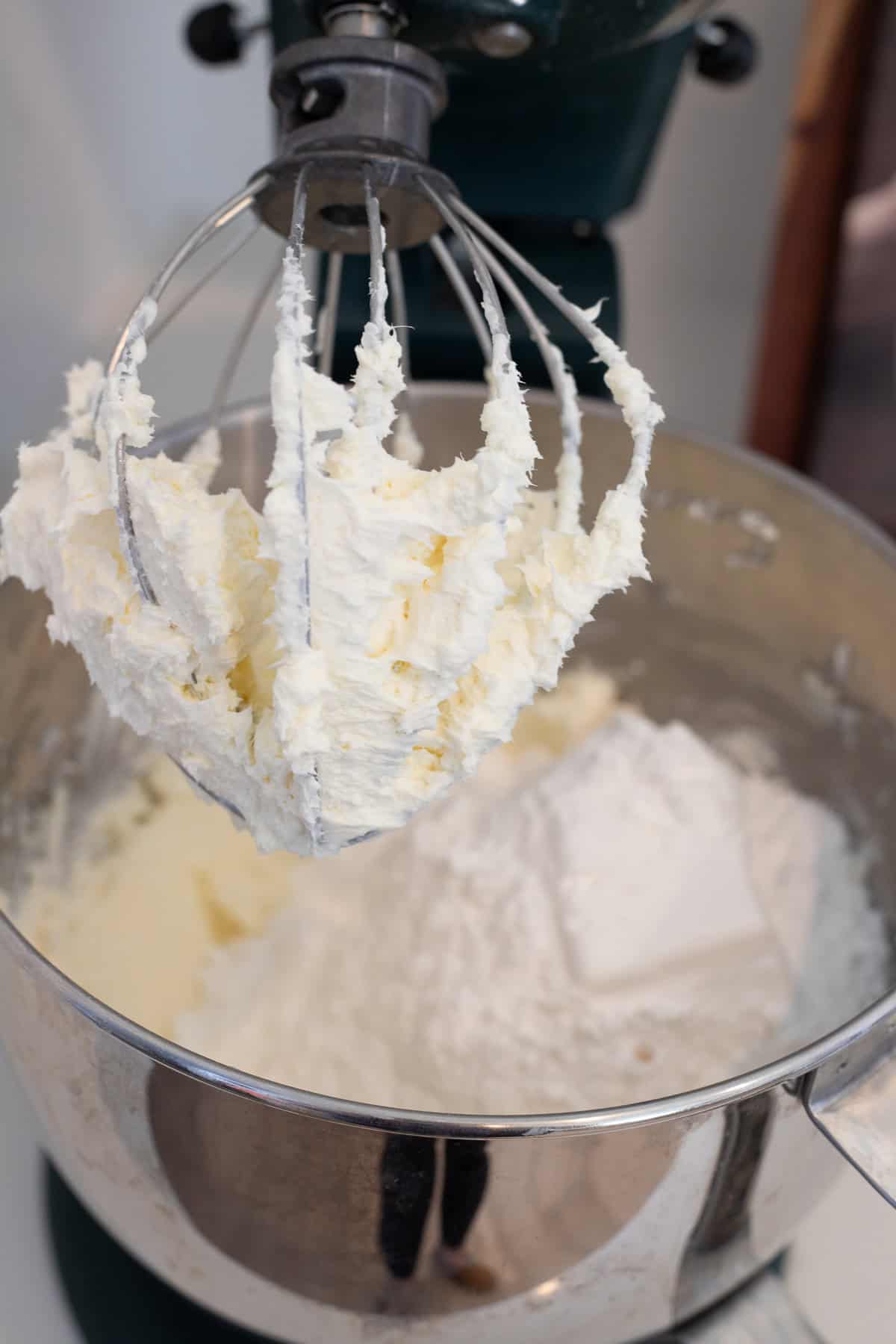 Whisk attachment that shows frosting.