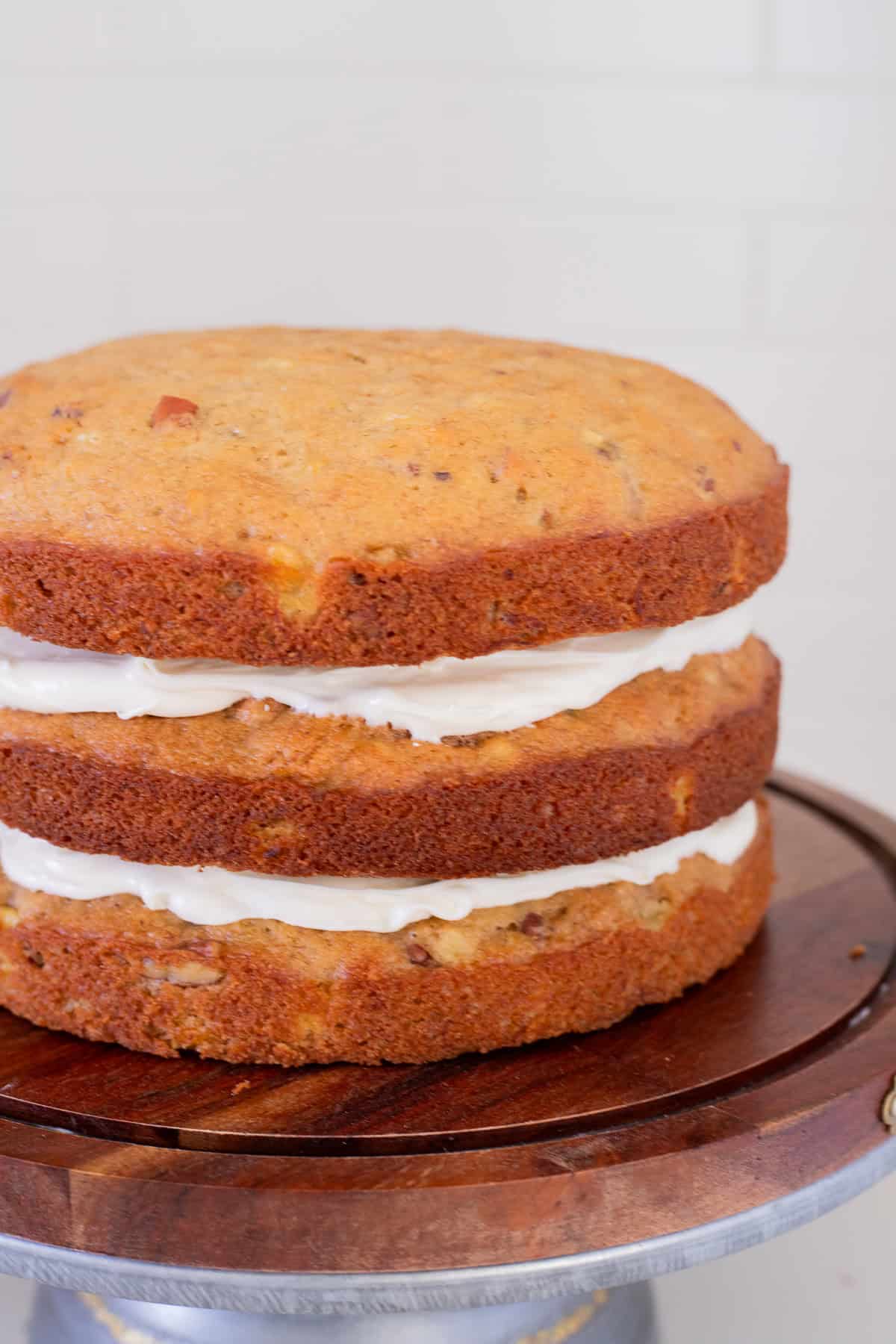 Layers of hummingbird cake with frosting in between.